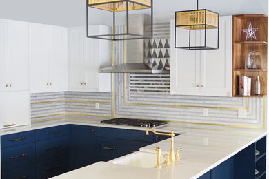 Inspiration for a transitional u-shaped kitchen remodel in Edmonton with a farmhouse sink, shaker cabinets, blue cabinets, quartzite countertops, multicolored backsplash, marble backsplash and stainless steel appliances