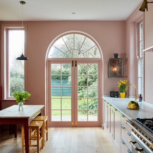 Design ideas for a medium sized classic single-wall kitchen/diner in London with a submerged sink, shaker cabinets, pink splashback, glass sheet splashback, no island, beige floors and grey worktops.