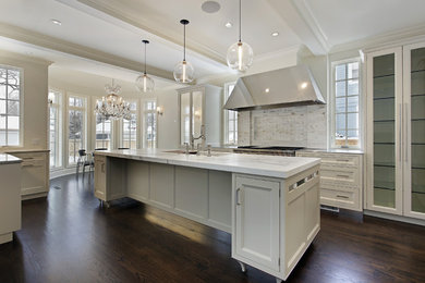 Huge transitional u-shaped dark wood floor, brown floor and coffered ceiling open concept kitchen photo in Atlanta with an undermount sink, beaded inset cabinets, white cabinets, marble countertops, white backsplash, stone tile backsplash, stainless steel appliances, an island and white countertops