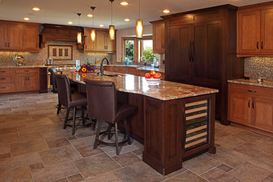 Large transitional l-shaped slate floor and beige floor enclosed kitchen photo in Minneapolis with shaker cabinets, medium tone wood cabinets, granite countertops, multicolored backsplash, mosaic tile backsplash, stainless steel appliances and an island
