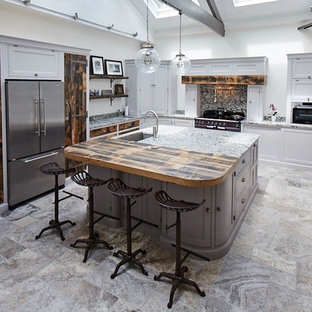 Medium sized classic l-shaped kitchen in Other with a submerged sink, grey cabinets, granite worktops, stainless steel appliances, an island, recessed-panel cabinets, multi-coloured splashback, stone slab splashback, multi-coloured floors and multicoloured worktops.