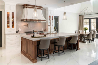 Kitchen - transitional l-shaped white floor kitchen idea in Other with an undermount sink, recessed-panel cabinets, white cabinets, gray backsplash, stone slab backsplash, stainless steel appliances, an island and gray countertops