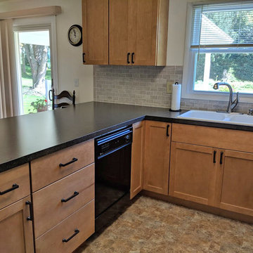 Transitional Kitchen with light Maple cabinets