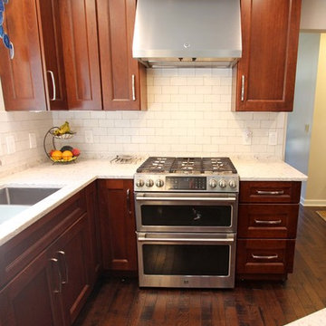 Transitional Kitchen with Medallion Cherry Cabinets and Quartz Countertop