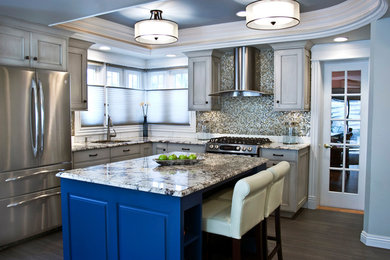 Transitional kitchen with painted cabinets, granite countertops, crown molding