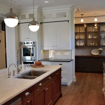 Transitional Kitchen with White Cabinets and Black Countertops