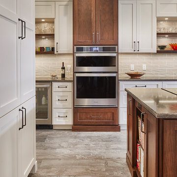 Transitional Kitchen with White Cabinets & Walnut features