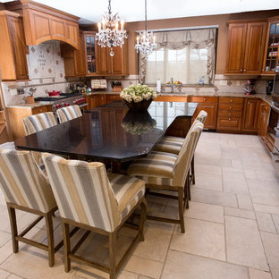 Photo of a mid-sized transitional u-shaped eat-in kitchen in Philadelphia with a drop-in sink, flat-panel cabinets, medium wood cabinets, zinc benchtops, beige splashback, terra-cotta splashback, stainless steel appliances, marble floors and with island.