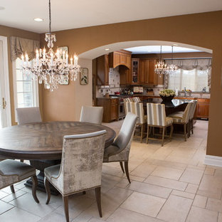 Inspiration for a mid-sized transitional u-shaped eat-in kitchen in Philadelphia with a drop-in sink, flat-panel cabinets, medium wood cabinets, zinc benchtops, beige splashback, terra-cotta splashback, stainless steel appliances, marble floors and with island.