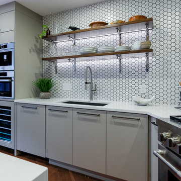 Transitional style kitchen with hexagon backslash