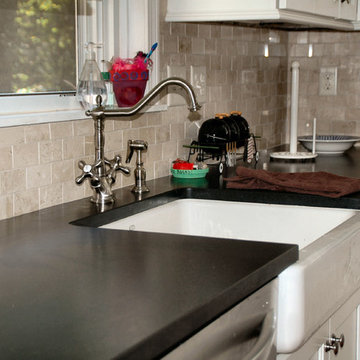 Transitional White Kitchen Remodel with Absolute Black leathered Countertop