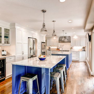 Transitional White Kitchen with Blue Islands