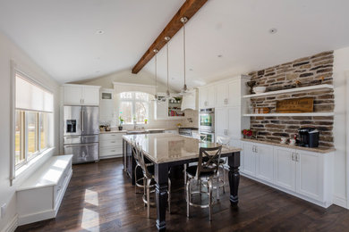 Large transitional l-shaped dark wood floor eat-in kitchen photo in Toronto with a farmhouse sink, shaker cabinets, white cabinets, quartz countertops, white backsplash, stainless steel appliances and an island