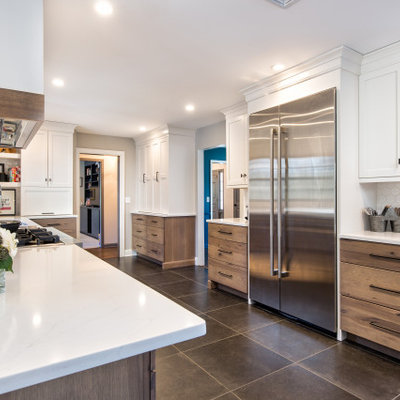 Open concept kitchen - mid-sized transitional u-shaped ceramic tile and gray floor open concept kitchen idea in New York with an undermount sink, shaker cabinets, medium tone wood cabinets, quartz countertops, white backsplash, ceramic backsplash, stainless steel appliances, an island and white countertops