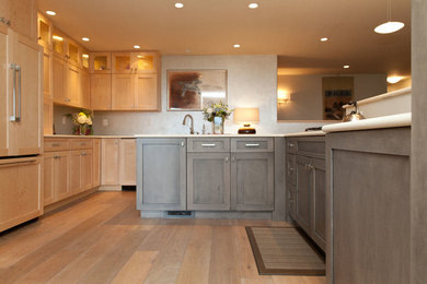 Large transitional light wood floor open concept kitchen photo in Other with an undermount sink, shaker cabinets, quartz countertops, paneled appliances and an island
