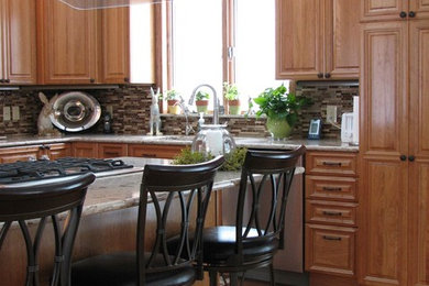 Example of a large classic cork floor kitchen design in Grand Rapids with raised-panel cabinets, medium tone wood cabinets, quartz countertops, multicolored backsplash, matchstick tile backsplash, stainless steel appliances and an island