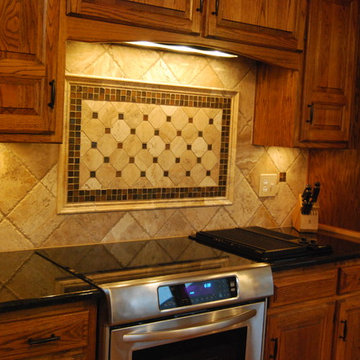 Travertine Tile Backsplash & Black Pearl Granite Countertop
