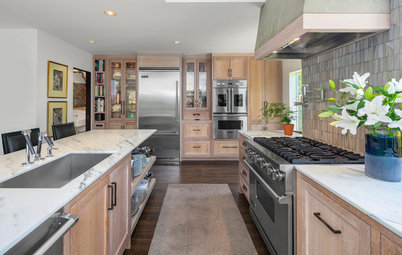 Oak Cabinets and a Stucco Hood Add Texture to This View Kitchen
