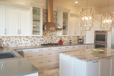 Inspiration for a large craftsman u-shaped travertine floor and multicolored floor enclosed kitchen remodel in Austin with an undermount sink, shaker cabinets, white cabinets, quartz countertops, multicolored backsplash, stone tile backsplash, stainless steel appliances and an island