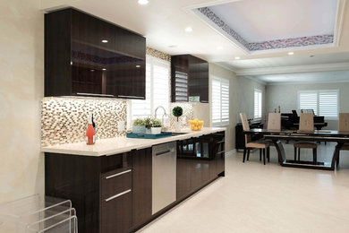 This is an example of a medium sized modern galley kitchen/diner in Los Angeles with a built-in sink, flat-panel cabinets, brown cabinets, engineered stone countertops, multi-coloured splashback, glass tiled splashback, stainless steel appliances, light hardwood flooring, no island, beige floors and beige worktops.