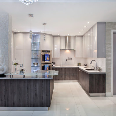 Huge minimalist l-shaped marble floor eat-in kitchen photo in Miami with a double-bowl sink, flat-panel cabinets, white cabinets, quartz countertops, white backsplash, mosaic tile backsplash, stainless steel appliances and an island