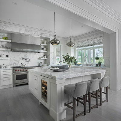 Example of a transitional l-shaped gray floor kitchen design in Detroit with recessed-panel cabinets, white cabinets, gray backsplash, stainless steel appliances, an island and gray countertops