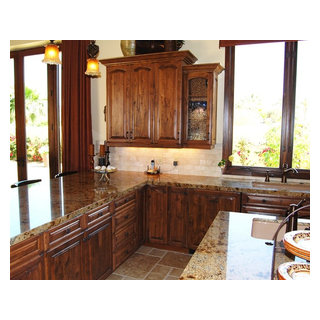 Tuscan Kitchen with Antique Bubble Glass Doors Mediterranean
