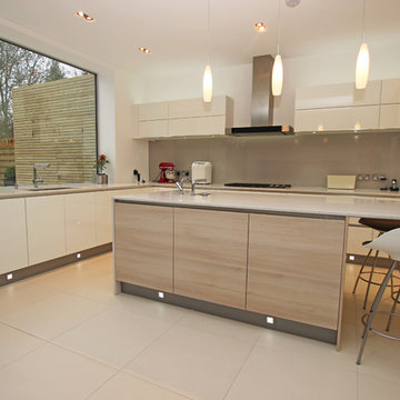 Two tone kitchen with light wood island