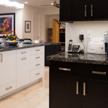 Two-toned full kitchen remodel featuring granite countertops