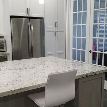 Two Toned Kitchen Full Remodel featuring White & Gray Cabinetry and Granite tops