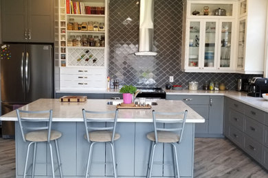 Inspiration for a large transitional l-shaped eat-in kitchen remodel in Other with shaker cabinets, gray cabinets and an island