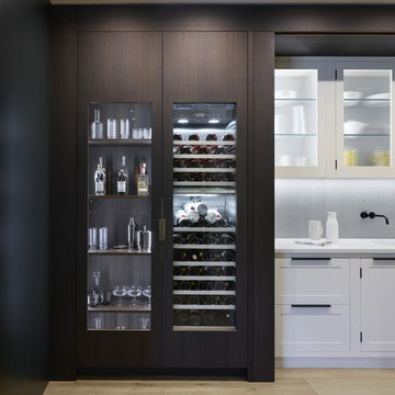 Ultra Contemporary Cabinetry with Hidden Traditional Kitchen Furniture