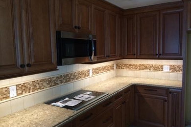 Example of a mid-sized classic kitchen design in Tampa
