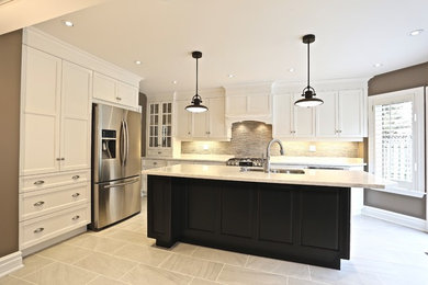 Large l-shaped kitchen photo in Toronto with an undermount sink, recessed-panel cabinets, beige cabinets, quartz countertops, stainless steel appliances and an island
