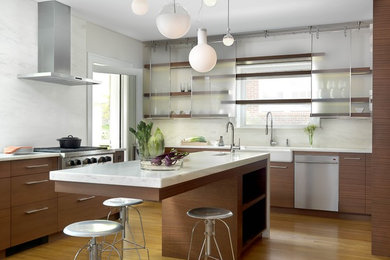 Eat-in kitchen - mid-sized contemporary u-shaped light wood floor eat-in kitchen idea in St Louis with stainless steel appliances, a farmhouse sink, flat-panel cabinets, dark wood cabinets, marble countertops, an island, white backsplash and stone slab backsplash