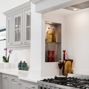Inspiration for a mid-sized traditional u-shaped open plan kitchen in Other with grey cabinets, quartzite benchtops, stainless steel appliances, marble floors, with island and yellow benchtop.