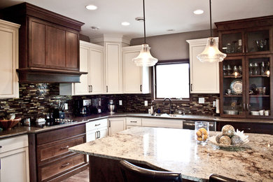 Mid-sized u-shaped vinyl floor eat-in kitchen photo in Other with an undermount sink, flat-panel cabinets, dark wood cabinets, granite countertops, multicolored backsplash, glass tile backsplash, colored appliances and an island