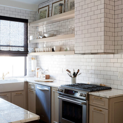 Transitional u-shaped eat-in kitchen photo in New York with a farmhouse sink, marble countertops, white backsplash, stainless steel appliances, beige cabinets, subway tile backsplash and raised-panel cabinets