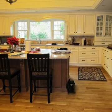 Upscale Softwhite Kitchen with Stained Wood Island