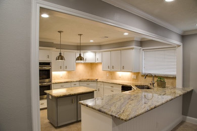 Inspiration for a mid-sized timeless u-shaped porcelain tile and multicolored floor eat-in kitchen remodel in Houston with an undermount sink, shaker cabinets, white cabinets, granite countertops, beige backsplash, porcelain backsplash, stainless steel appliances and an island