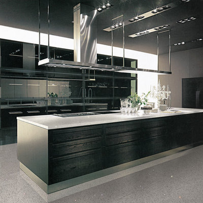 Example of a mid-sized minimalist galley marble floor open concept kitchen design in Milwaukee with flat-panel cabinets, black cabinets, quartzite countertops, stainless steel appliances and an island