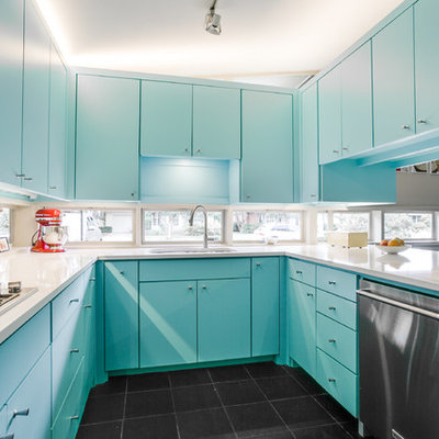 Enclosed kitchen - mid-sized mid-century modern u-shaped slate floor and black floor enclosed kitchen idea in Dallas with an undermount sink, flat-panel cabinets, blue cabinets, stainless steel appliances, quartz countertops and window backsplash