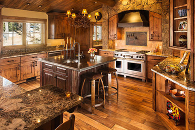 Inspiration for a rustic light wood floor kitchen remodel in Denver with medium tone wood cabinets, granite countertops, stainless steel appliances and an island