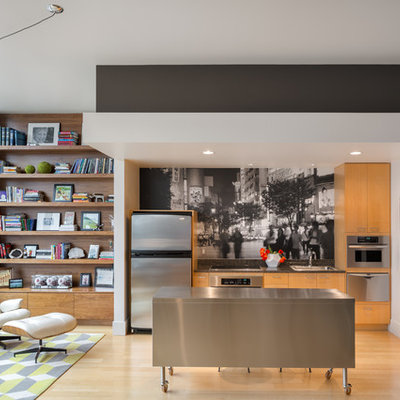 Open concept kitchen - contemporary single-wall open concept kitchen idea in Portland with a drop-in sink, flat-panel cabinets, medium tone wood cabinets, stainless steel countertops, multicolored backsplash and stainless steel appliances