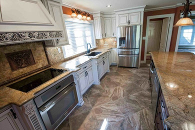 Eat-in kitchen - large traditional porcelain tile and brown floor eat-in kitchen idea in Other with an undermount sink, beaded inset cabinets, dark wood cabinets, granite countertops, multicolored backsplash, stone tile backsplash, stainless steel appliances and an island