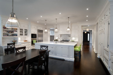 Inspiration for a large contemporary l-shaped dark wood floor eat-in kitchen remodel in Toronto with recessed-panel cabinets, white cabinets, marble countertops, white backsplash, stone tile backsplash, stainless steel appliances and an island
