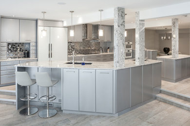 Example of a large minimalist single-wall gray floor eat-in kitchen design in Calgary with an undermount sink, flat-panel cabinets, gray cabinets, quartz countertops, metallic backsplash, white appliances, two islands and multicolored countertops