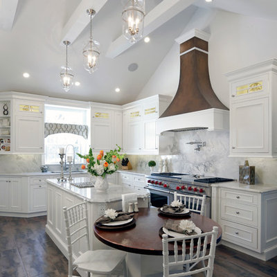 Example of a large cottage l-shaped porcelain tile eat-in kitchen design in New York with recessed-panel cabinets, white cabinets, white backsplash, stainless steel appliances, an island and an undermount sink