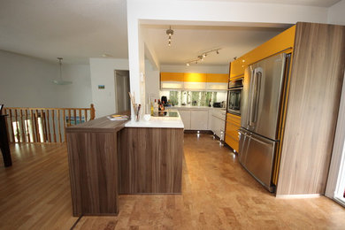 Small minimalist galley enclosed kitchen photo in Other with white backsplash, stainless steel appliances and no island