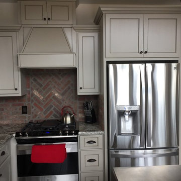 Very clean kitchen, love the use of stainless along with the brick